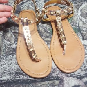 Used womens sandals with pearls.